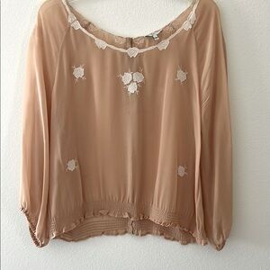 Intricately designed sheer peach blouse in superb condition.